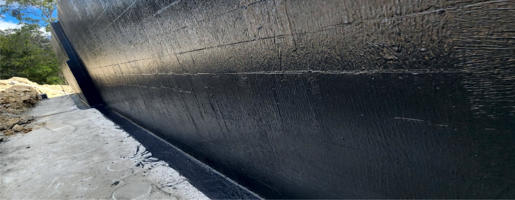 Bituminous waterproof coating applied on wall surface for moisture protection