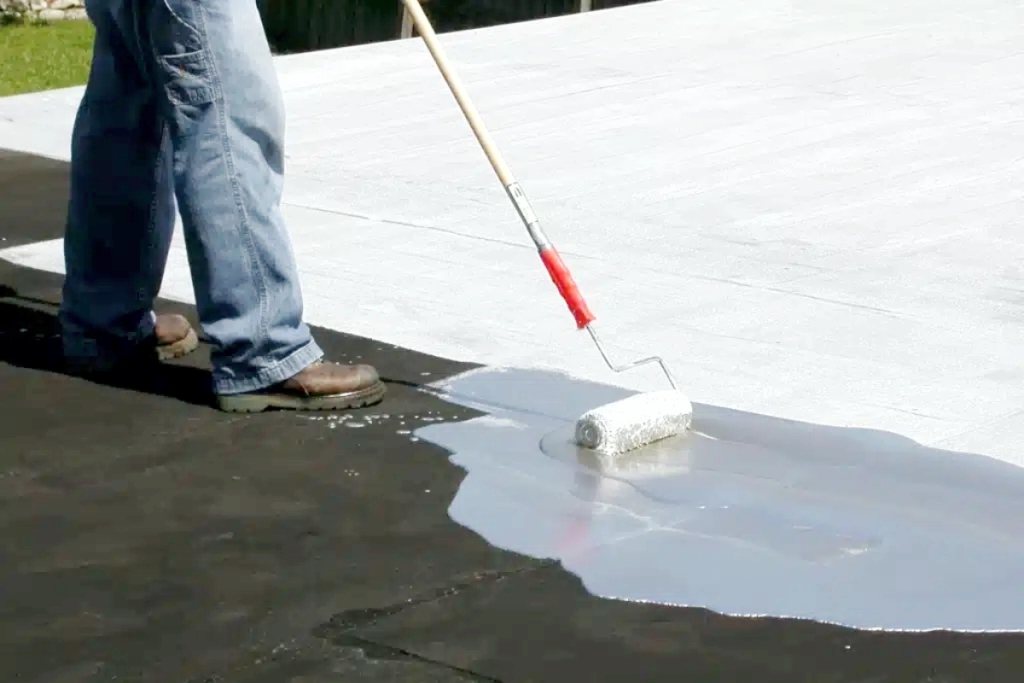 polyurethane waterproofing coating applied on roof surface using roller